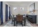 Elegant dining room featuring dark wooden table, blue drapes, and wall decor at 111 Old Field Rd, Statesville, NC 28677