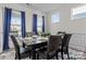 Dining room featuring wood table, six chairs and large window with natural light at 111 Old Field Rd, Statesville, NC 28677