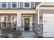 Inviting front porch with rocking chairs and stone accents, offering a cozy welcome at 111 Old Field Rd, Statesville, NC 28677