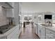 Bright kitchen with stainless steel appliances, white cabinets, and view to breakfast nook at 111 Old Field Rd, Statesville, NC 28677
