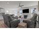 Bright and airy living room featuring a fireplace and ceiling fan at 111 Old Field Rd, Statesville, NC 28677