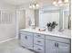 Elegant bathroom featuring double sinks, a spacious counter, and modern fixtures for a luxurious feel at 12233 Gambrell Dr, Charlotte, NC 28278