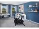 Well-lit exercise room with an elliptical machine, desk, and shelving, promoting a healthy and active lifestyle at 12233 Gambrell Dr, Charlotte, NC 28278