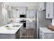Well-appointed kitchen with a large island, stainless steel appliances, and stylish gray cabinets at 12233 Gambrell Dr, Charlotte, NC 28278