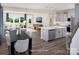 Bright, open-concept kitchen featuring a spacious island with pendant lighting and seamless flow to the living area at 12233 Gambrell Dr, Charlotte, NC 28278