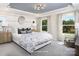 Serene main bedroom with large windows, ample natural light, and stylish decor, creating a relaxing retreat at 12233 Gambrell Dr, Charlotte, NC 28278