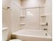 Clean bathroom features a tub/shower combo with built-in shelving and chrome fixtures at 12237 Gambrell Dr, Charlotte, NC 28278