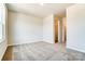 Neutral bedroom with carpet flooring, light walls, and view to walk-in closet at 12237 Gambrell Dr, Charlotte, NC 28278