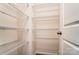 Walk-in closet with ample storage space with white wire shelving at 12237 Gambrell Dr, Charlotte, NC 28278