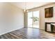 Open dining area with wood floors, stainless steel dishwasher, and access to backyard at 12237 Gambrell Dr, Charlotte, NC 28278