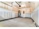 Large garage with high ceilings, concrete floors, and a water heater at 12237 Gambrell Dr, Charlotte, NC 28278