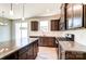 Modern kitchen with stainless steel appliances, granite countertops, and hanging pendant lights at 12237 Gambrell Dr, Charlotte, NC 28278