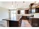 Modern kitchen with granite countertops, stainless steel appliances, and wood floors at 12237 Gambrell Dr, Charlotte, NC 28278
