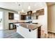 Stylish kitchen featuring a large island with granite countertops, stainless steel appliances, and modern lighting at 12237 Gambrell Dr, Charlotte, NC 28278
