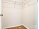 Walk-in closet showing wire shelving and carpeted floor at 12237 Gambrell Dr, Charlotte, NC 28278