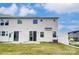 Home's backyard has lawn space and a patio with a view of neighboring homes at 12241 Gambrell Dr, Charlotte, NC 28278