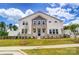 Charming two-story home with stone accents and professionally landscaped front yard at 12241 Gambrell Dr, Charlotte, NC 28278