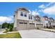 Townhome with a three-car garage and professionally landscaped front yard at 12241 Gambrell Dr, Charlotte, NC 28278