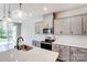 A detailed view of the kitchen reveals stainless steel appliances, granite counter tops, and wooden cabinets at 12241 Gambrell Dr, Charlotte, NC 28278