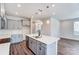 A modern kitchen featuring a large center island and open access to other rooms in the home at 12241 Gambrell Dr, Charlotte, NC 28278