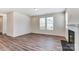 Spacious living room features a fireplace, large windows, and hardwood floors for a bright atmosphere at 12241 Gambrell Dr, Charlotte, NC 28278