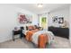 Bright bedroom features unique decor, neutral carpet, and ample natural light at 1402 Richmond Dr # 1, Lowell, NC 28098