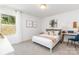 Bright bedroom with neutral carpet features a work desk, and a large window at 1402 Richmond Dr # 1, Lowell, NC 28098