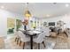 Bright dining area with modern table and chairs, open to the living room and kitchen, creating an inviting space at 1402 Richmond Dr # 1, Lowell, NC 28098