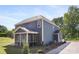 Side view of a two story home featuring a screened porch and blue siding at 1402 Richmond Dr # 1, Lowell, NC 28098