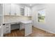 Well-lit office with custom built-ins, ample workspace, and stylish wallpaper at 1402 Richmond Dr # 1, Lowell, NC 28098