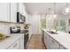Beautiful modern kitchen with stainless steel appliances, quartz countertops and view to backyard at 1402 Richmond Dr # 1, Lowell, NC 28098