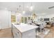 Spacious kitchen with a large island, stainless steel appliances, and seamless flow into the dining and living spaces at 1402 Richmond Dr # 1, Lowell, NC 28098