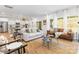 Spacious living room with a view of the kitchen, featuring contemporary sofas and abundant natural light at 1402 Richmond Dr # 1, Lowell, NC 28098