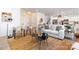 Open-concept living room with stylish furnishings, a textured rug, and views leading into the kitchen area at 1402 Richmond Dr # 1, Lowell, NC 28098