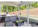 Screened-in porch with comfortable seating and views of the landscaped backyard at 1402 Richmond Dr # 1, Lowell, NC 28098