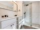 Beautiful bathroom with a double vanity, quartz countertops, and a tiled walk-in shower at 1522 Wickham Ln, Charlotte, NC 28208