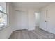 This bedroom features a large closet and new flooring, providing comfort and style at 1522 Wickham Ln, Charlotte, NC 28208