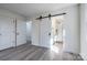 A bright bedroom leads to an en suite bathroom featuring an elegant glass enclosed shower at 1522 Wickham Ln, Charlotte, NC 28208