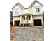 Unfinished two story duplex features double front entryways and garage doors awaiting customization at 2526 Elkwood Cir, Charlotte, NC 28205