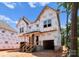 New home under construction with covered entryway, visible window frames, and unfinished siding at 2526 Elkwood Cir, Charlotte, NC 28205