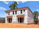 New home construction featuring covered patios and large windows at 2526 Elkwood Cir, Charlotte, NC 28205