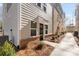 Charming townhome entrance with modern black door and well-kept landscaping at 3812 Odom Way, Charlotte, NC 28216