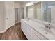 Bathroom featuring double sinks, white vanity, and walk in shower at 508 Stone River Pkwy, Mount Holly, NC 28120