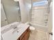 Bathroom with a single vanity, tile floors, and tub-shower combo at 508 Stone River Pkwy, Mount Holly, NC 28120