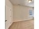 Clean bedroom with neutral carpet, a window with blinds, and a white door at 508 Stone River Pkwy, Mount Holly, NC 28120