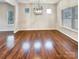 Dining room with a modern chandelier and ample natural light at 508 Stone River Pkwy, Mount Holly, NC 28120