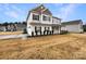 Charming two-story home with an attached two car garage and manicured landscaping at 508 Stone River Pkwy, Mount Holly, NC 28120