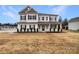 Charming two-story home with black shutters, covered porch and manicured landscaping at 508 Stone River Pkwy, Mount Holly, NC 28120