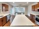 Modern kitchen showcasing a large island, stainless steel appliances, and seamless flow to the living area at 508 Stone River Pkwy, Mount Holly, NC 28120