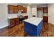 Kitchen with stainless steel appliances, white countertops, and blue kitchen island at 508 Stone River Pkwy, Mount Holly, NC 28120